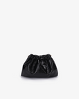 A black scrunch waxed vegan leather mini bag with a shiny exterior and a magnetic snap closure by Remi and Reid.