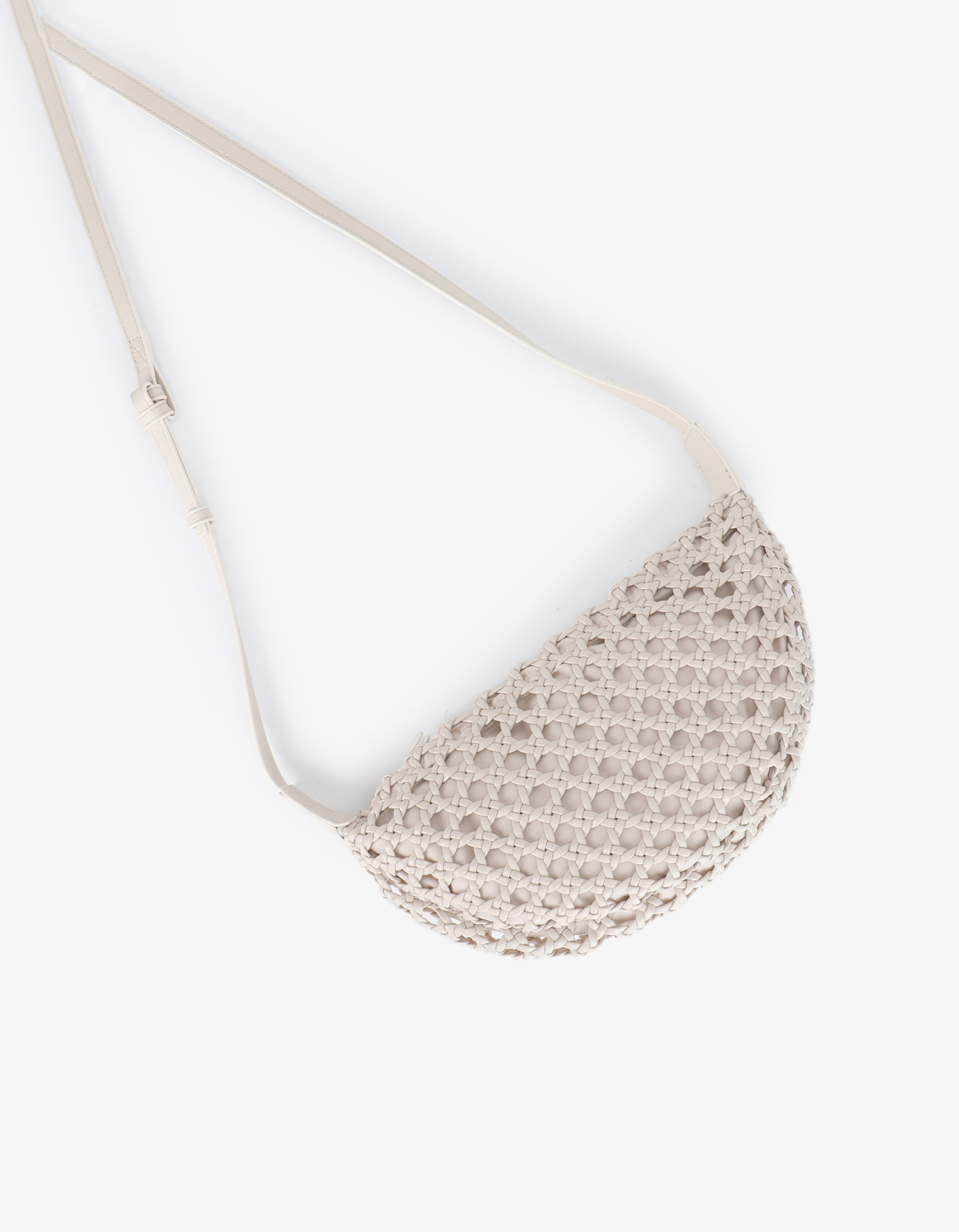 Anais woven crossbody shoulder bag in color of cream made of vegan leather by Remi and Reid