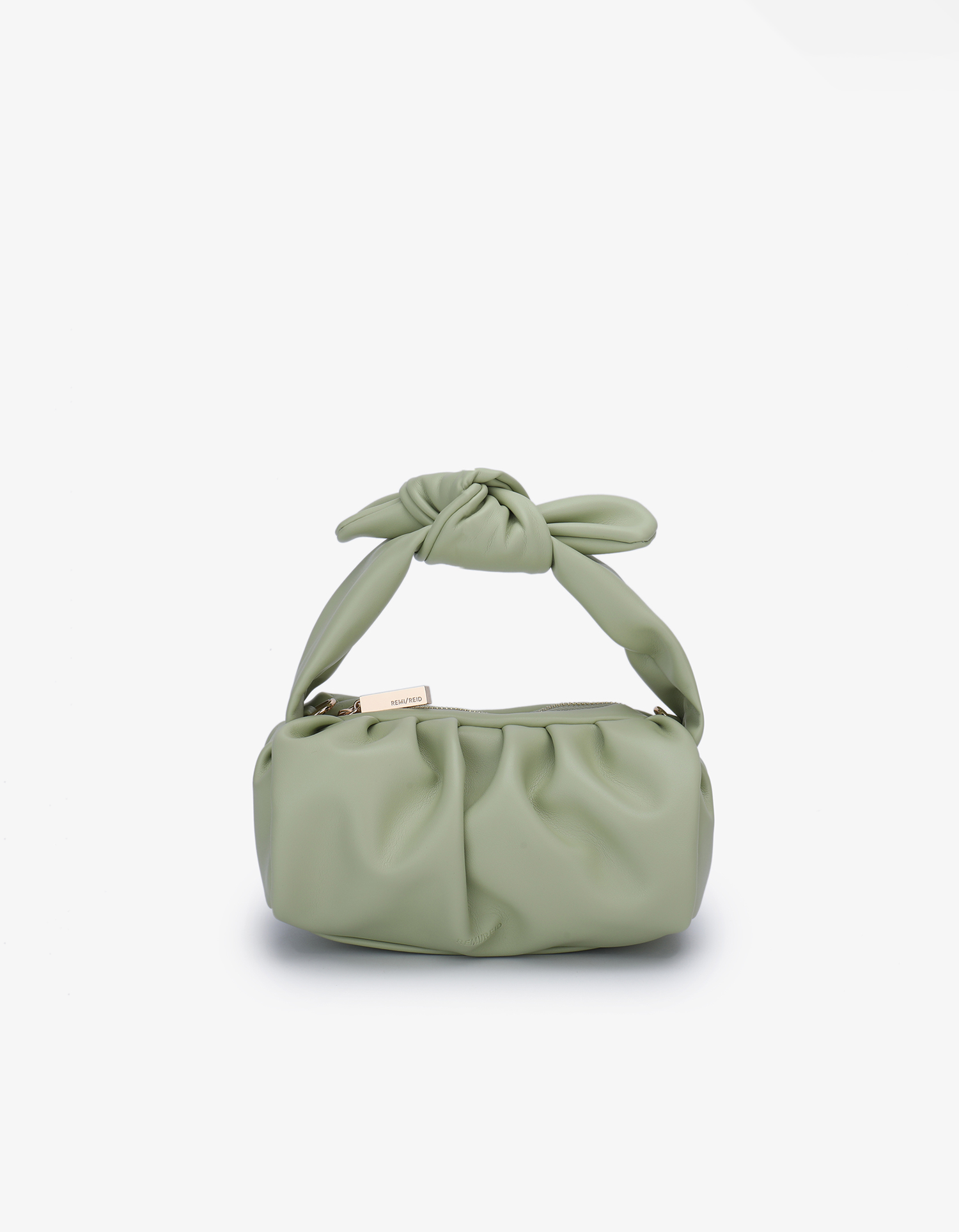 A small, avocado green pleated handbag with a removable bow tie on the handle, featuring light gold hardware and a zipper closure.