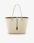 Reversible cream and taupe colored tote bag with a sleek design and a removable security pouch.