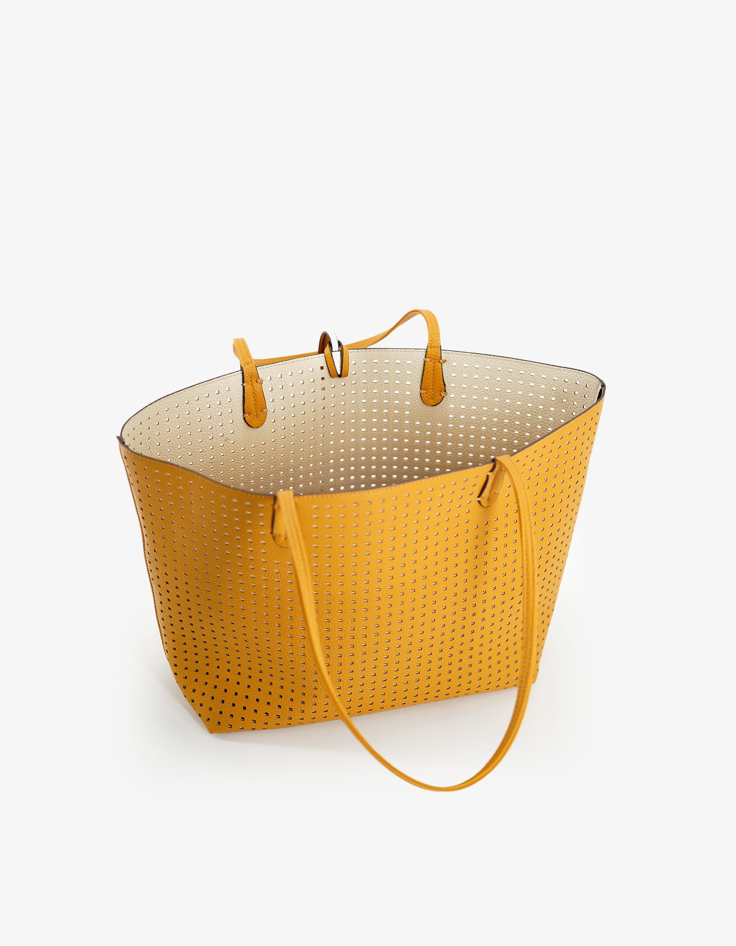Large Mustard yellow tote by Remi and Reid with a cream interior and perforated square design