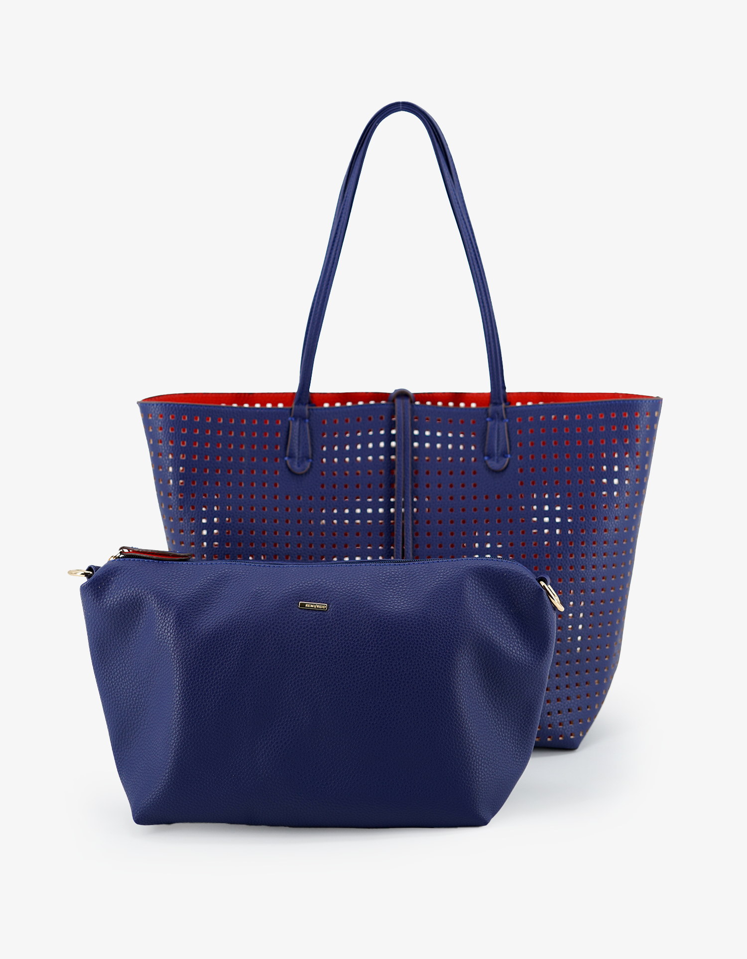 Reversible Departure Tote Perforated Square in royal blue and coral red by Remi and Reid with matching pouch.