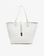 White and gold reversible Departure Tote handbag with a sleek design and a removable security pouch by Remi and Reid