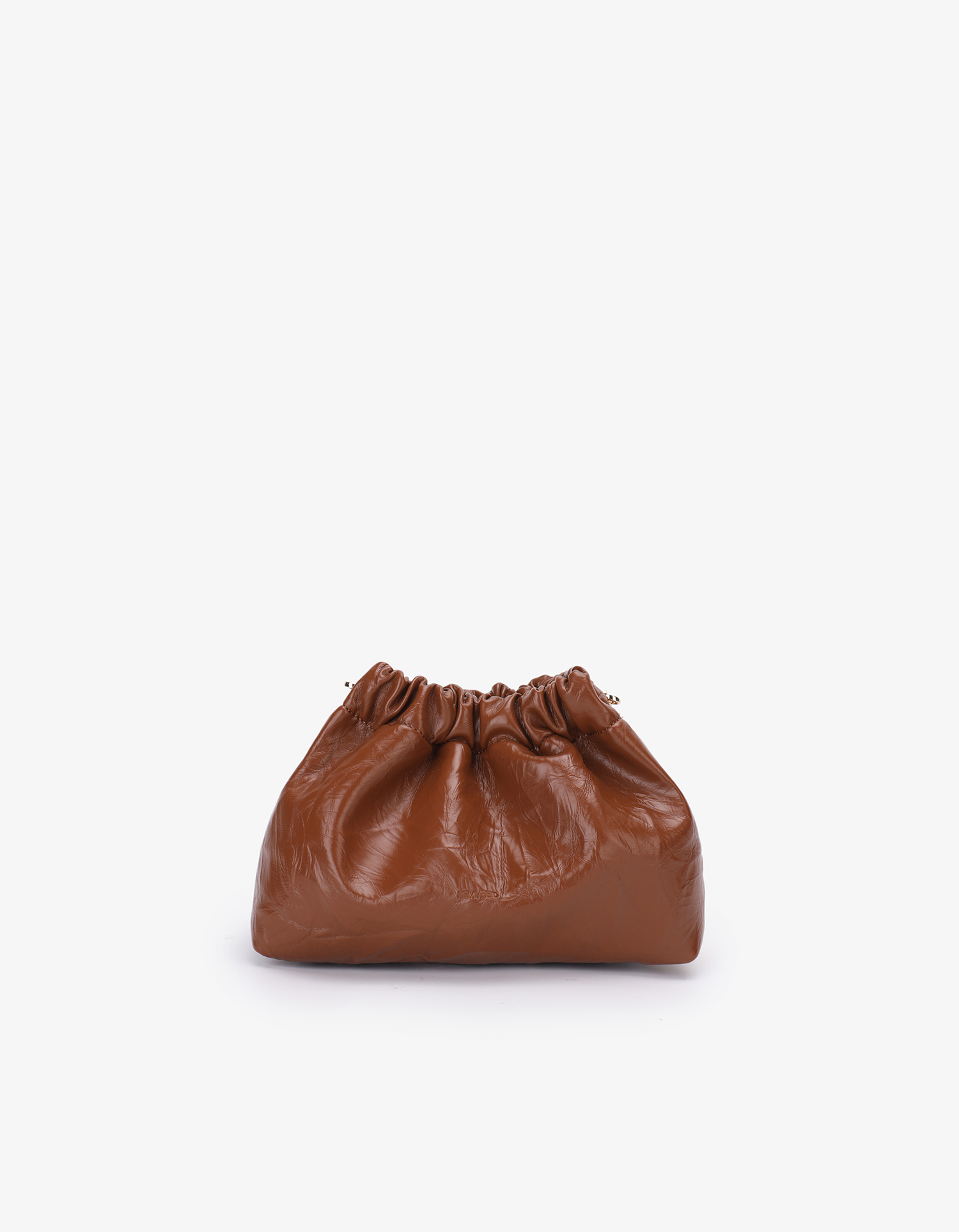 A brown mini scrunch handbag with a waxed vegan leather exterior by Remi and Reid.