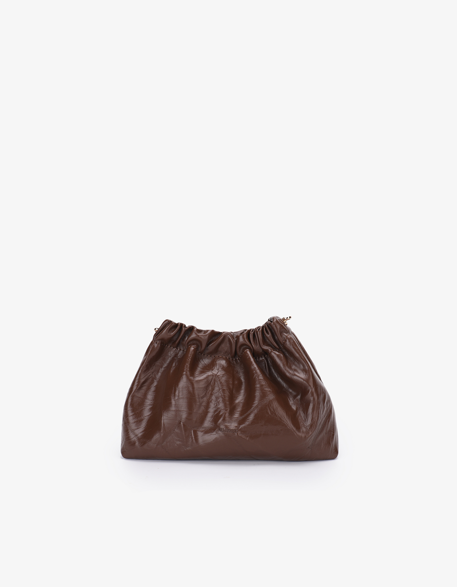 A brown Effie Mini Scrunch bag made from waxed vegan leather, displayed against a neutral background by Remi and Reid.