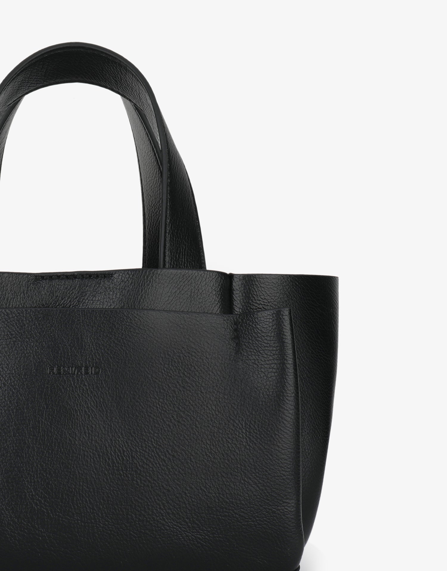 Black mini tote bag with front pocket details_Remi and Reid