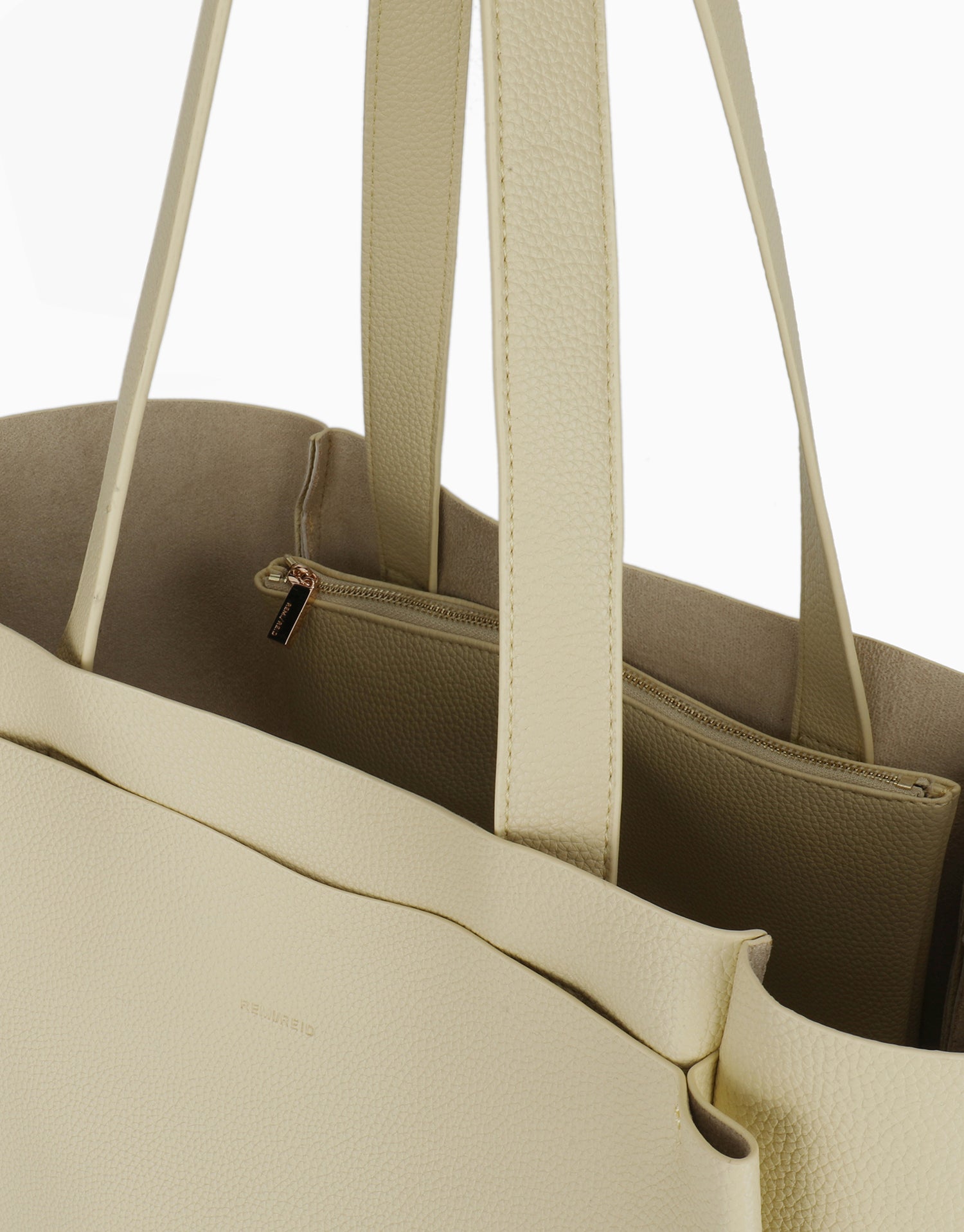 Close-up of yellow tote bag with zipper compartment details_Remi and Reid