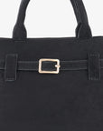 Close-up of black faux suede mini doctor bag with belted strap_Remi and Reid