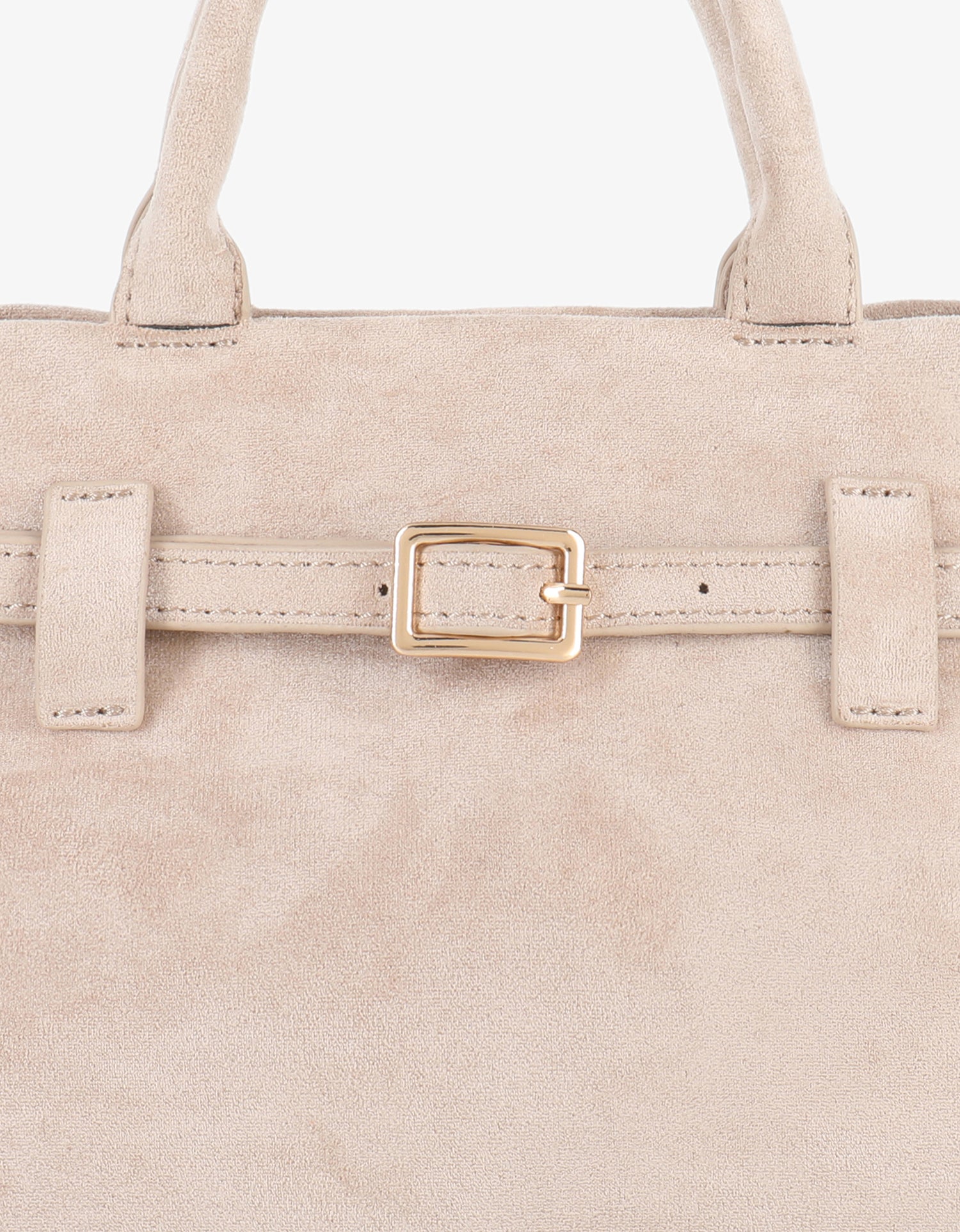 Close-up of beige faux suede mini doctor bag with a belted strap_Remi and Reid