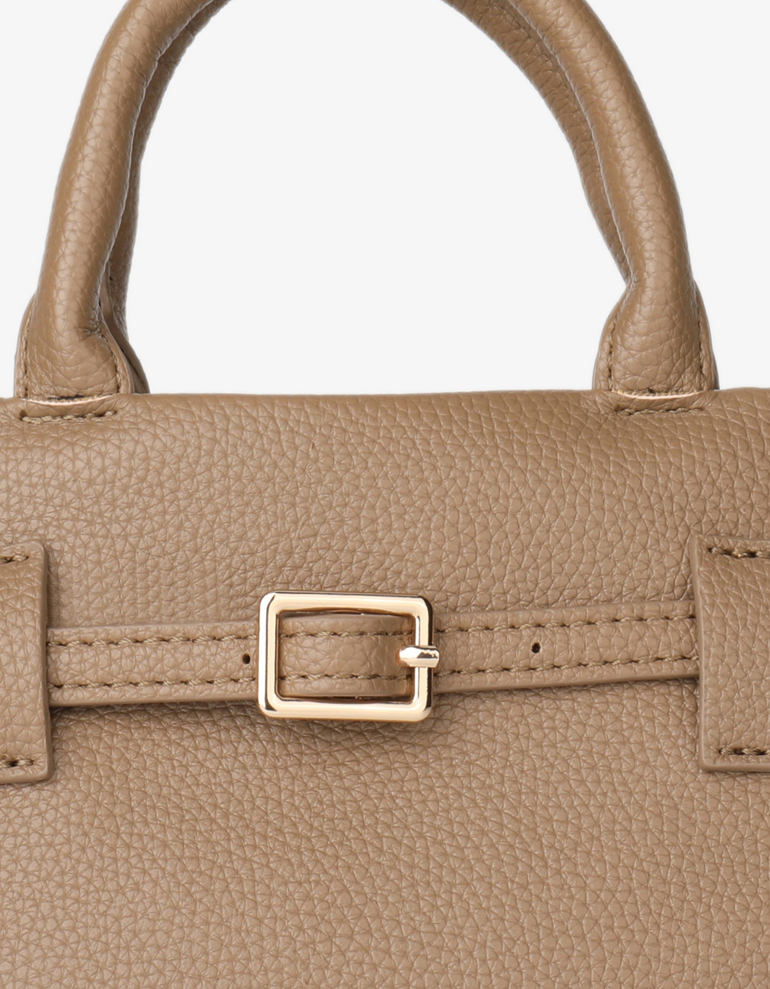 Close-up taupe pebble grain leather mini handbag with top handle and belt detail_Remi and Reid