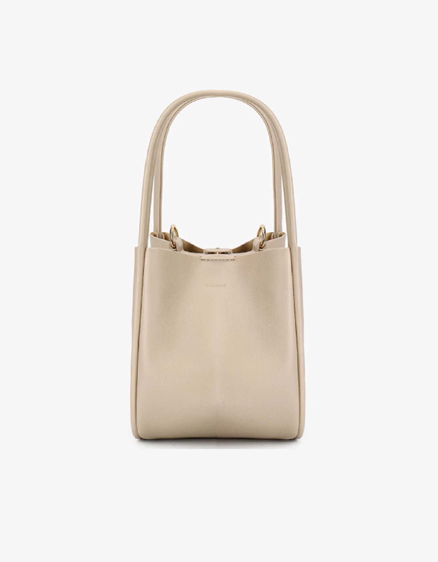 A cream-colored mini tote handbag with two handles by Remi and Reid.