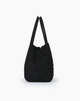 Side details of black bucket bag with top handles_Remi and Reid
