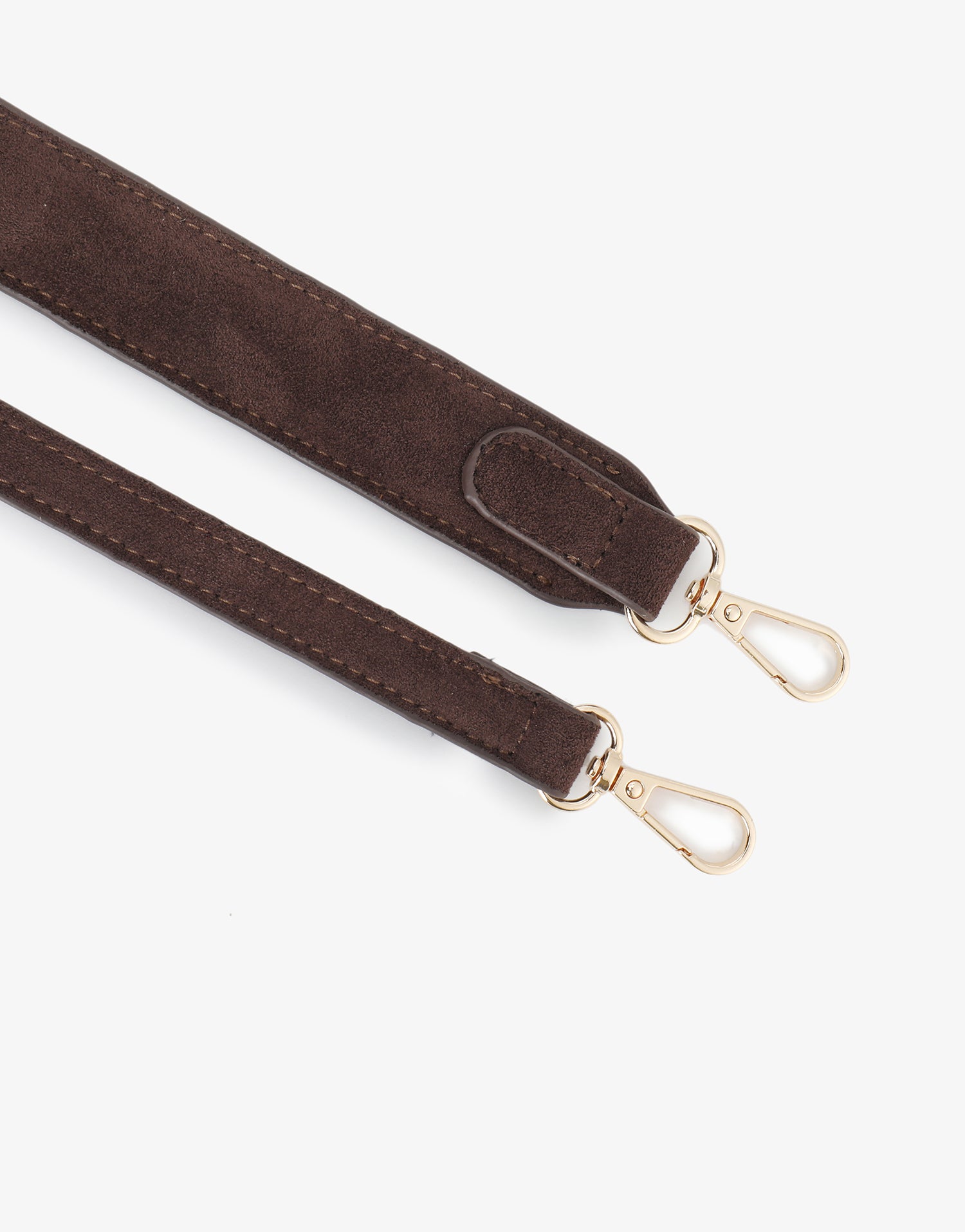 Close-up of brown faux suede strap with gold hardware_Remi and Reid