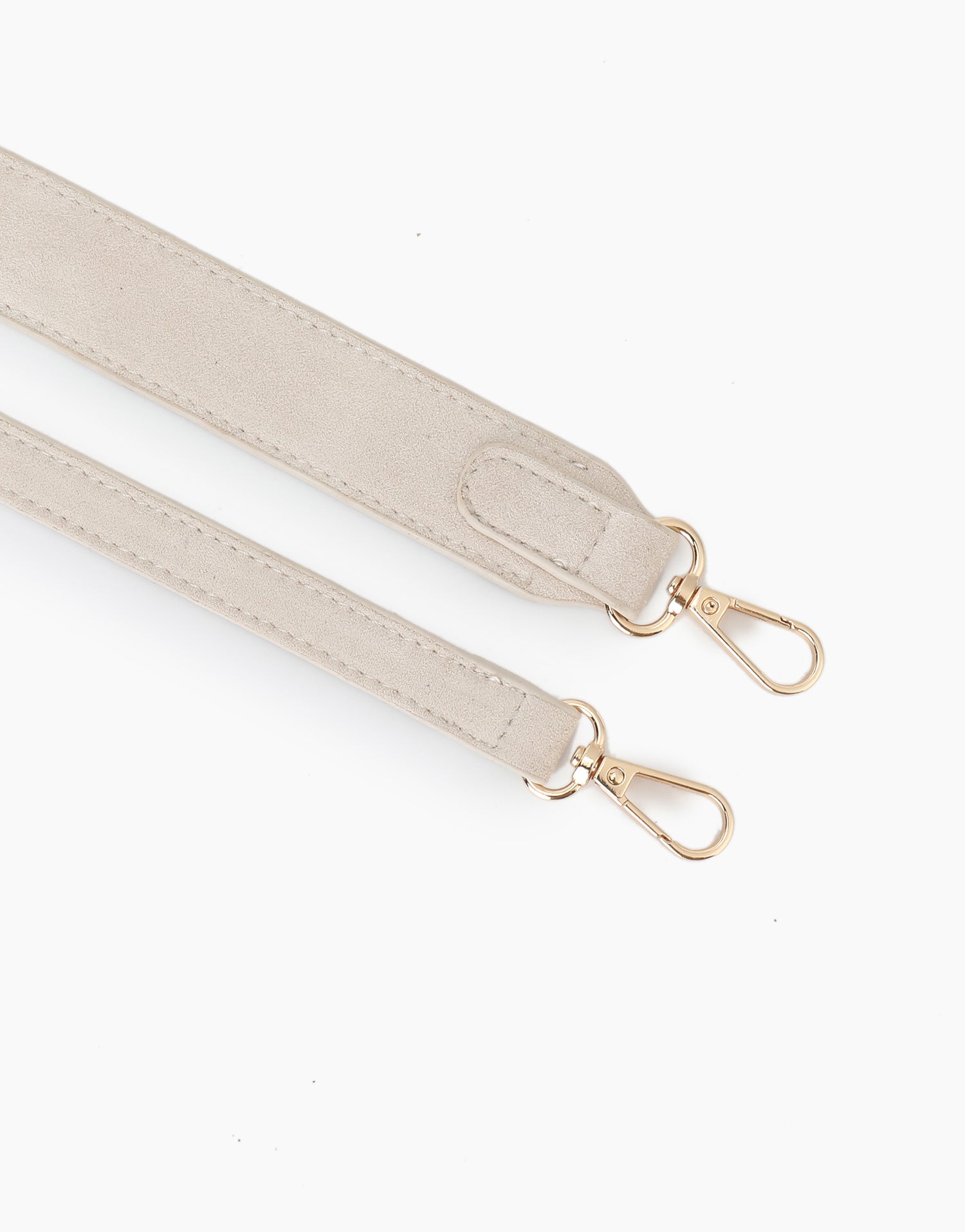 Close-up view of cream white faux suede body and shoulder straps_Remi and Reid