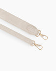 Close-up view of cream white faux suede body and shoulder straps_Remi and Reid