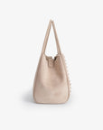 Beige handbag with decorative studs_Remi and Reid