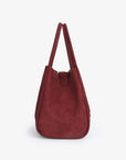 Side details of wine red faux suede handbag_Remi and Reid