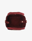 Spacious interior of faux suede handbag with snap closure_Remi and Reid