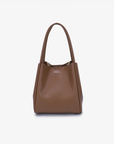 A taupe-colored mini tote handbag with two handles and a detachable crossbody strap by Remi and Reid.