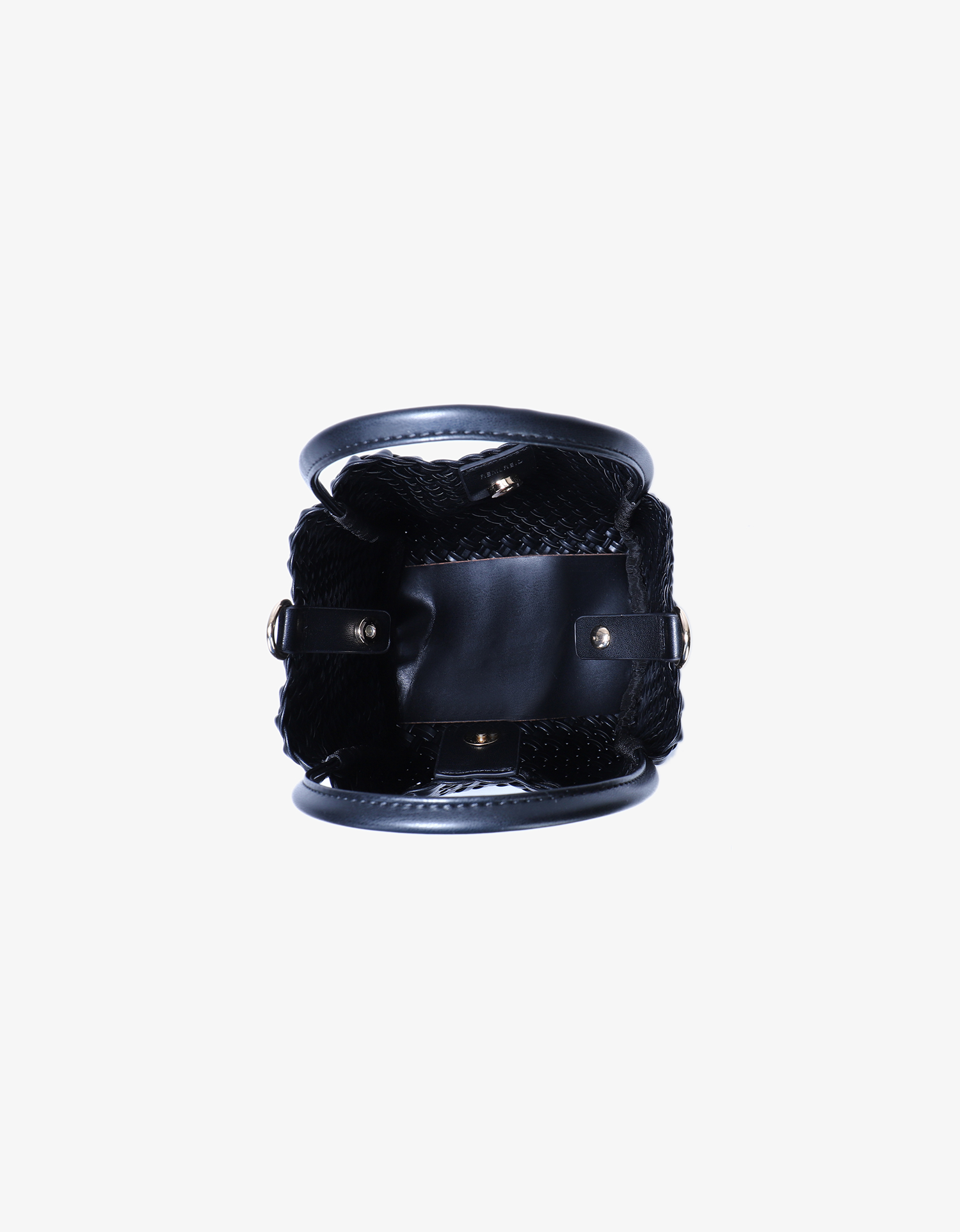 Interior of woven mini tote by Remi and Reid in black variation with magnetic snap closure.