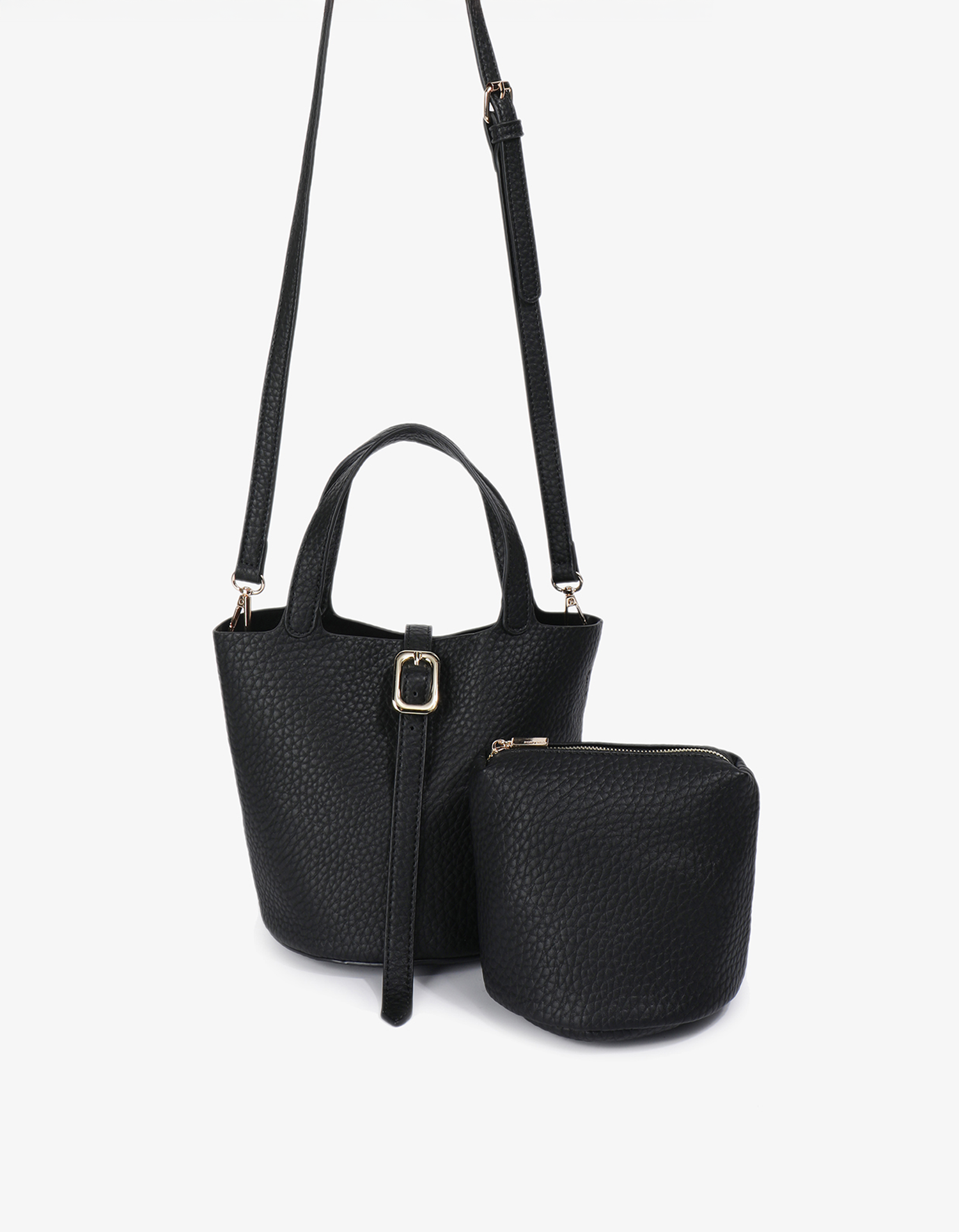 Joya Bucket Mini Black by Remi and Reid displayed with adjustable crossbody strap and matching textured vegan leather pouch.