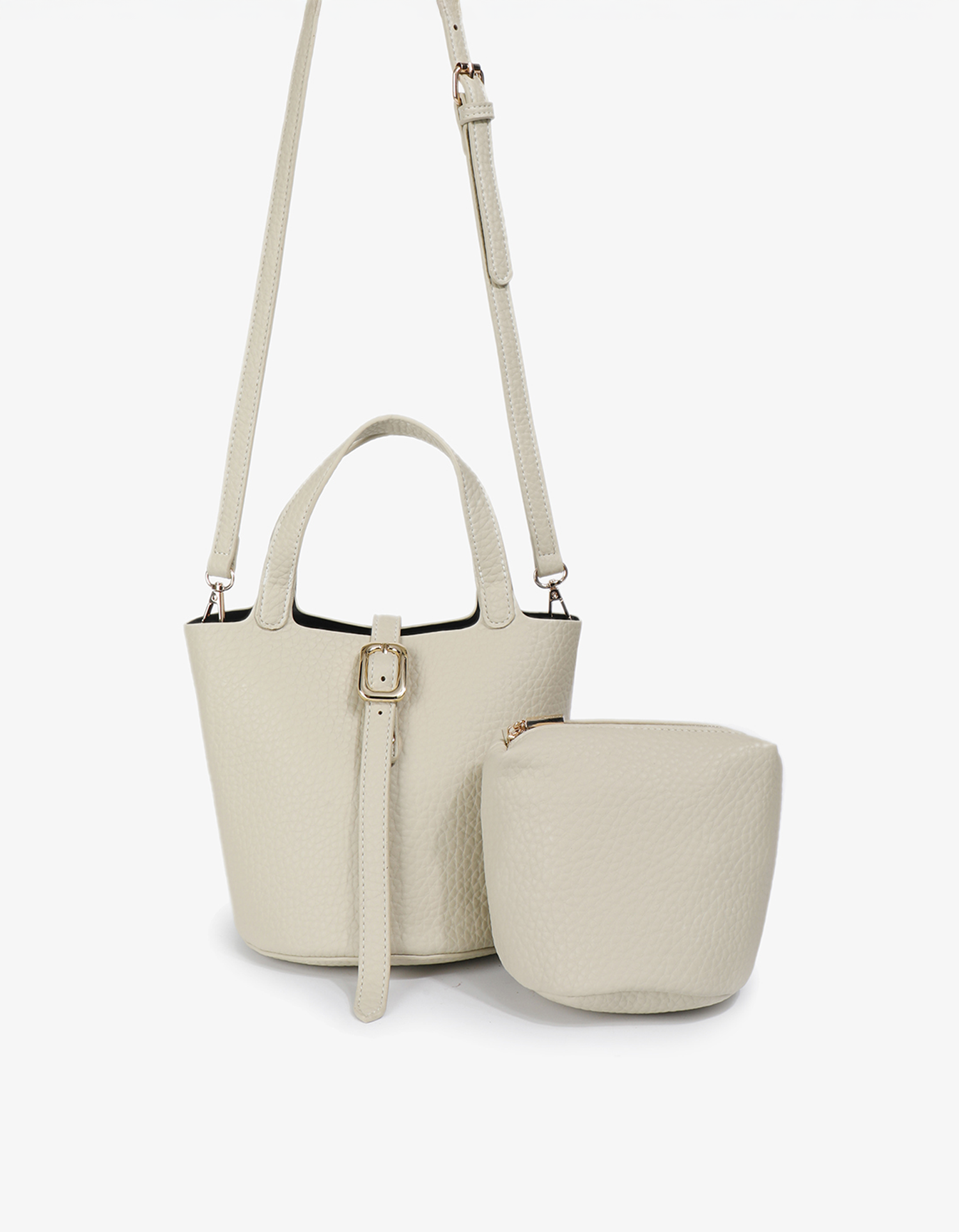 Cream Joya Bucket Mini set including a crossbody strap and a matching pebbled vegan leather pouch by Remi and Reid.