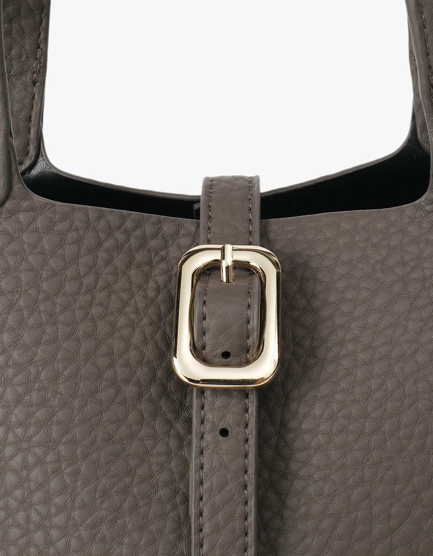 Close-up detail of Joya mini bucket bag in dark grey featuring the front buckle closure design by Remi and Reid.