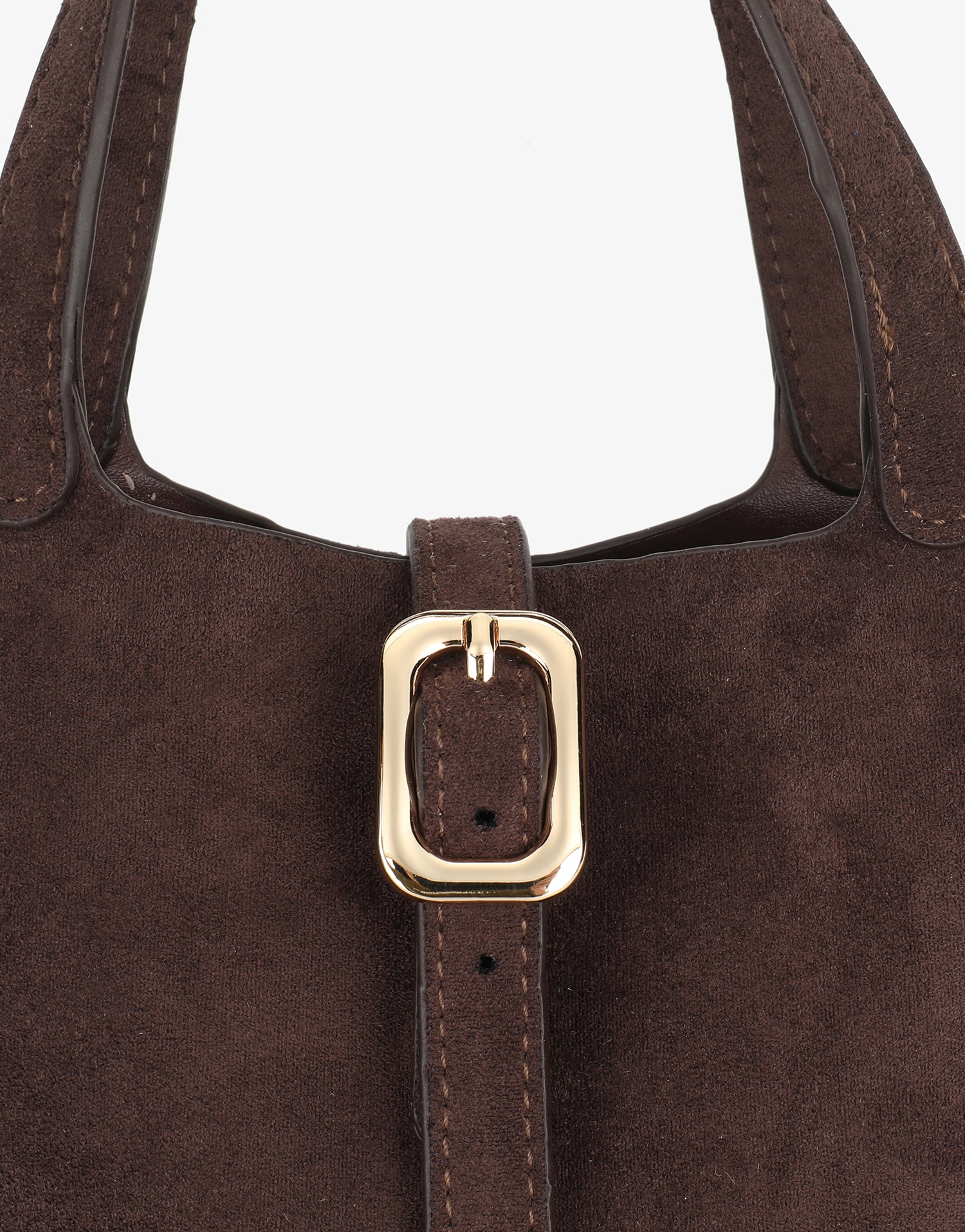Close-up of brown faux suede handbag with gold buckle design_Remi and Reid