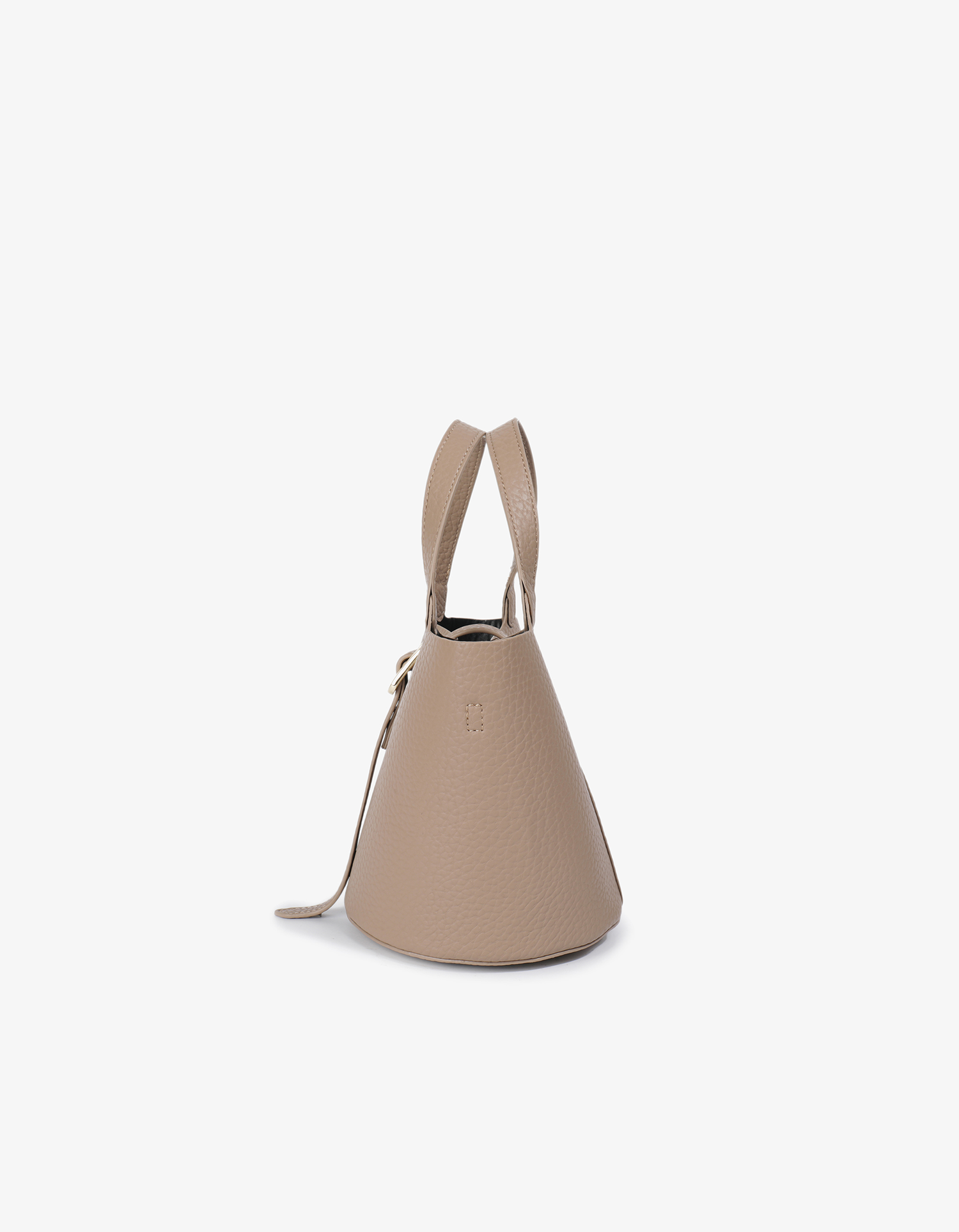 Side details of Joya mini bucket bag featuring the sturdy design in faux suede taupe by Remi and Reid.