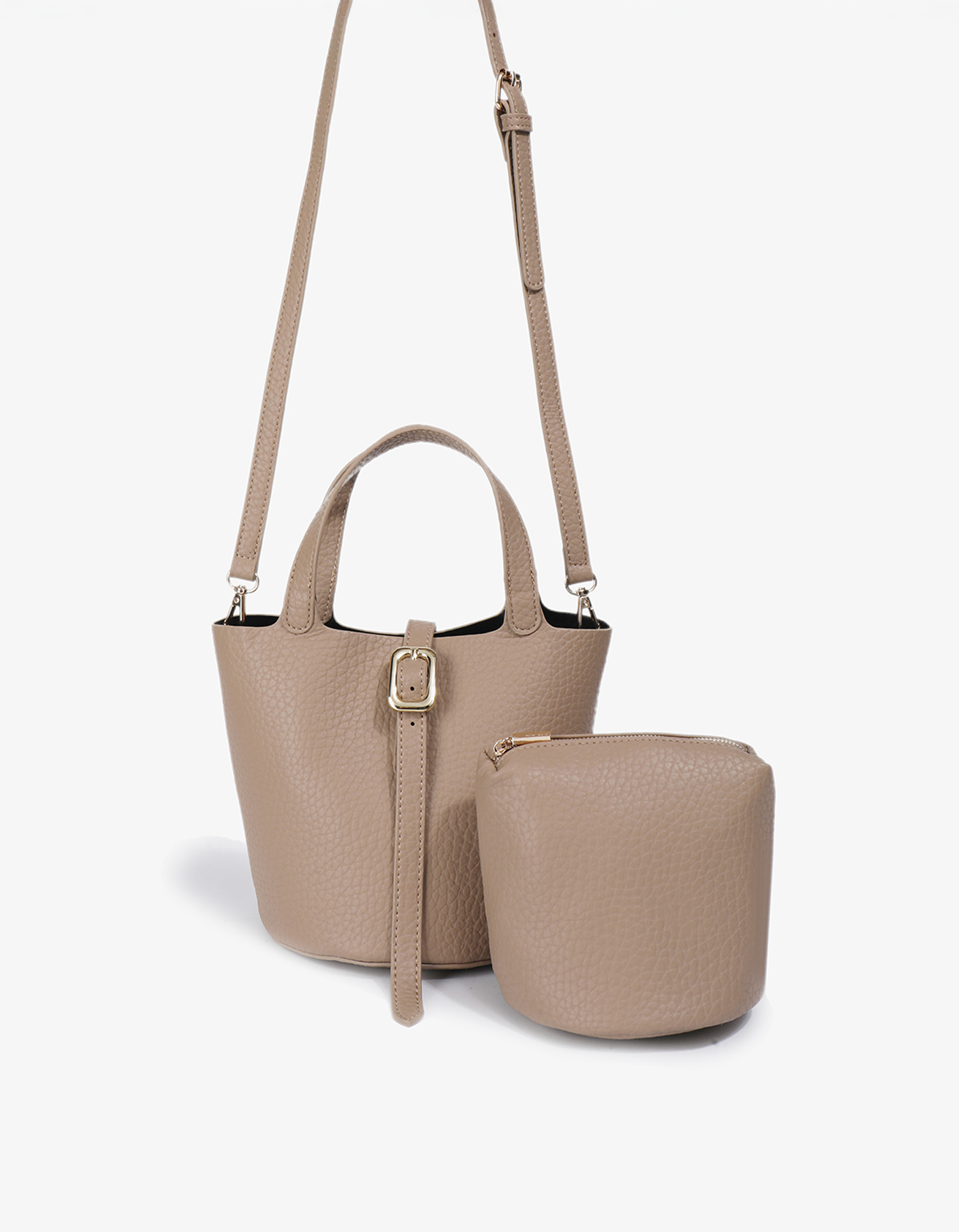 Joya mini bucket bag in taupe with adjustable body strap and matching pouch  by Remi and Reid.