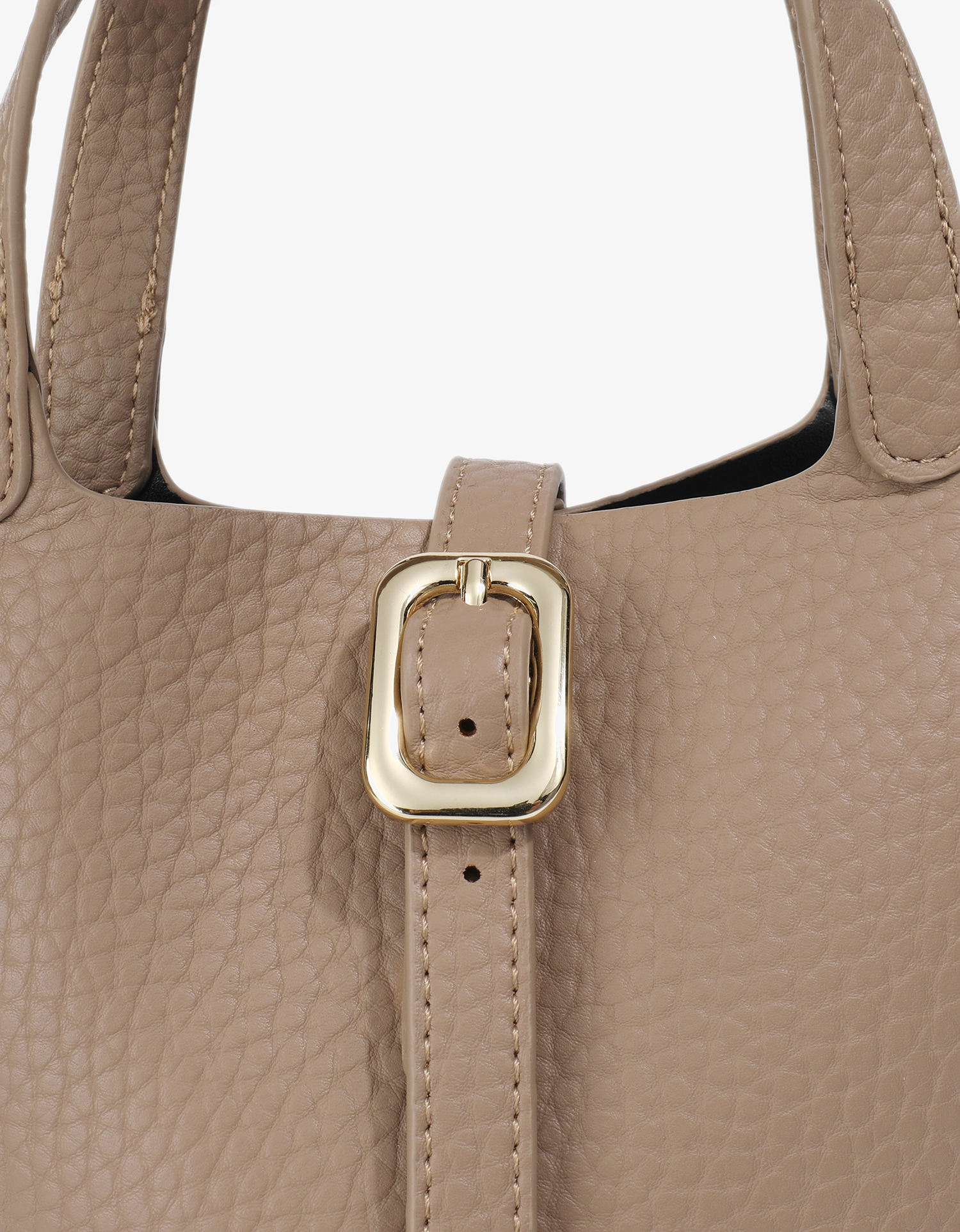 Close-up detail of Joya mini bucket bag with front buckle closure by Remi and Reid.