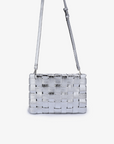 Metallic silver woven clutch bag with adjustable and removable crossbody strap by Remi and Reid.