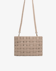 Beige woven handbag with a strap by Remi and Reid.