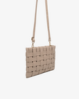 Light tan woven handbag with a strap by Remi and Reid.
