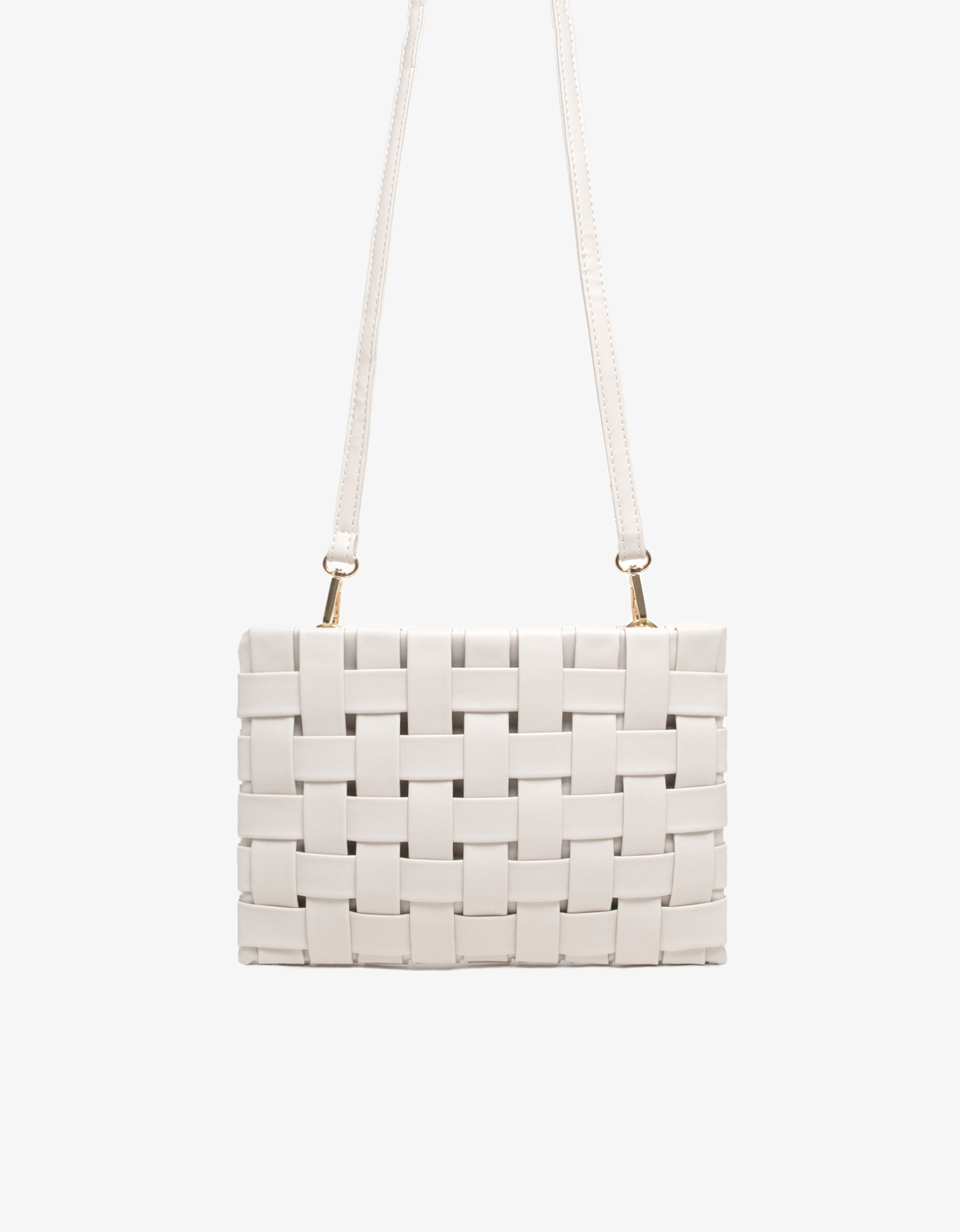 Large white woven handbag with adjustable crossbody strap by Remi and Reid.