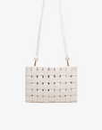 Large white woven handbag with adjustable crossbody strap by Remi and Reid.