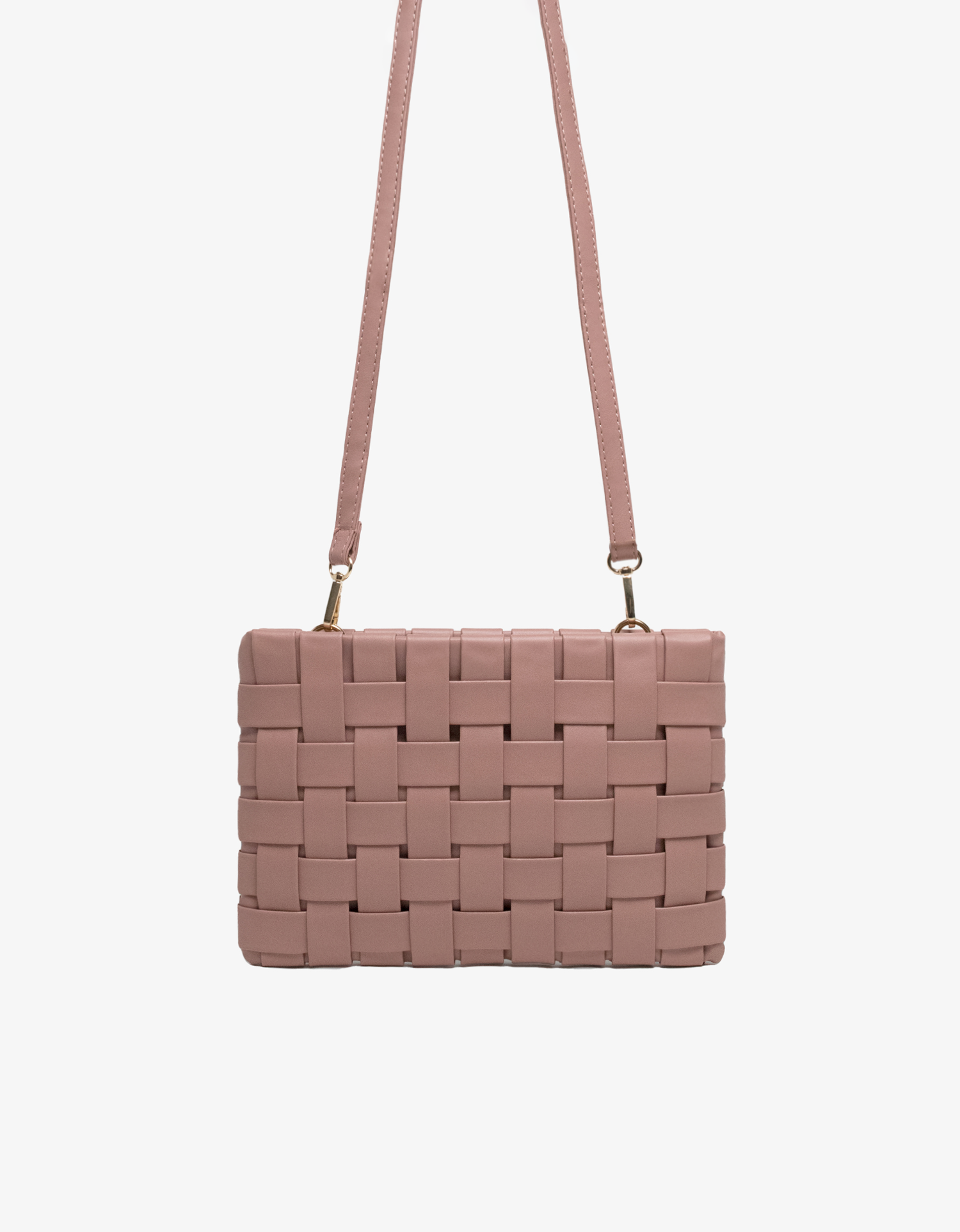 Pink woven handbag with crossbody strap by Remi and Reid.