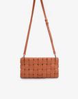 Small woven Lindy clutch bag with a detachable body strap in apricot variation by Remi and Reid.