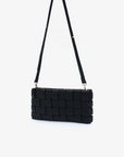 Small black woven clutch bag with adjustable crossbody strap by Remi and Reid.