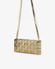 Metallic gold woven handbag with a  crossbody strap by Remi and Reid.