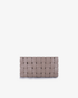 A light tan woven clutch with a closed top zipper by Remi and Reid.