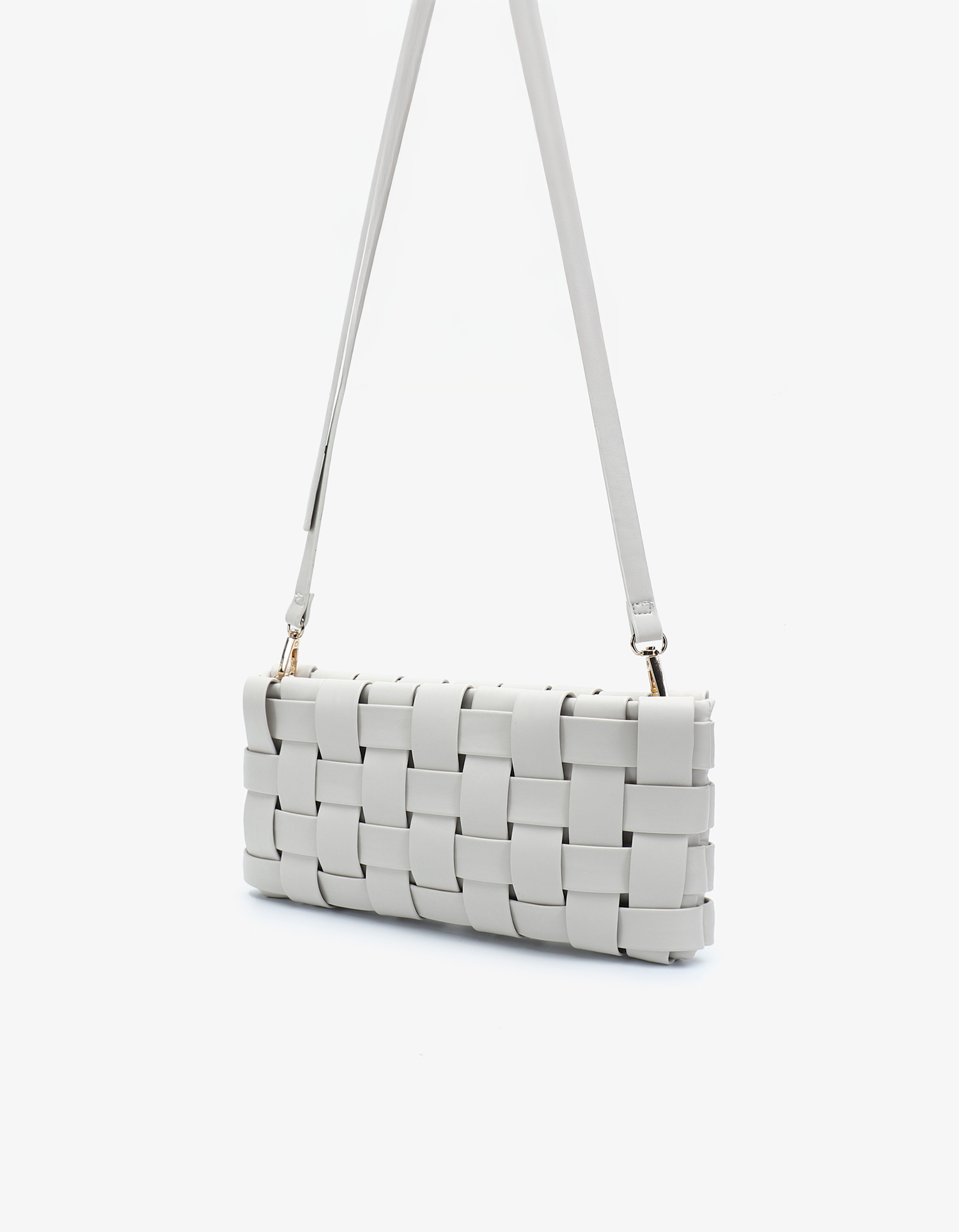 Small white woven clutch bag with detachable, adjustable crossbody strap by Remi and Reid.