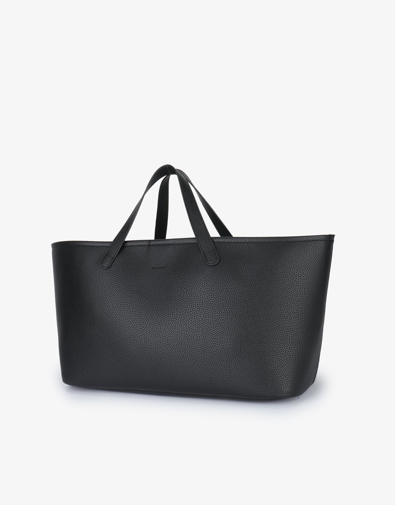 Remi and Reid Nala Tote East West Short in black pebbled vegan leather with a wide silhouette and short handles.