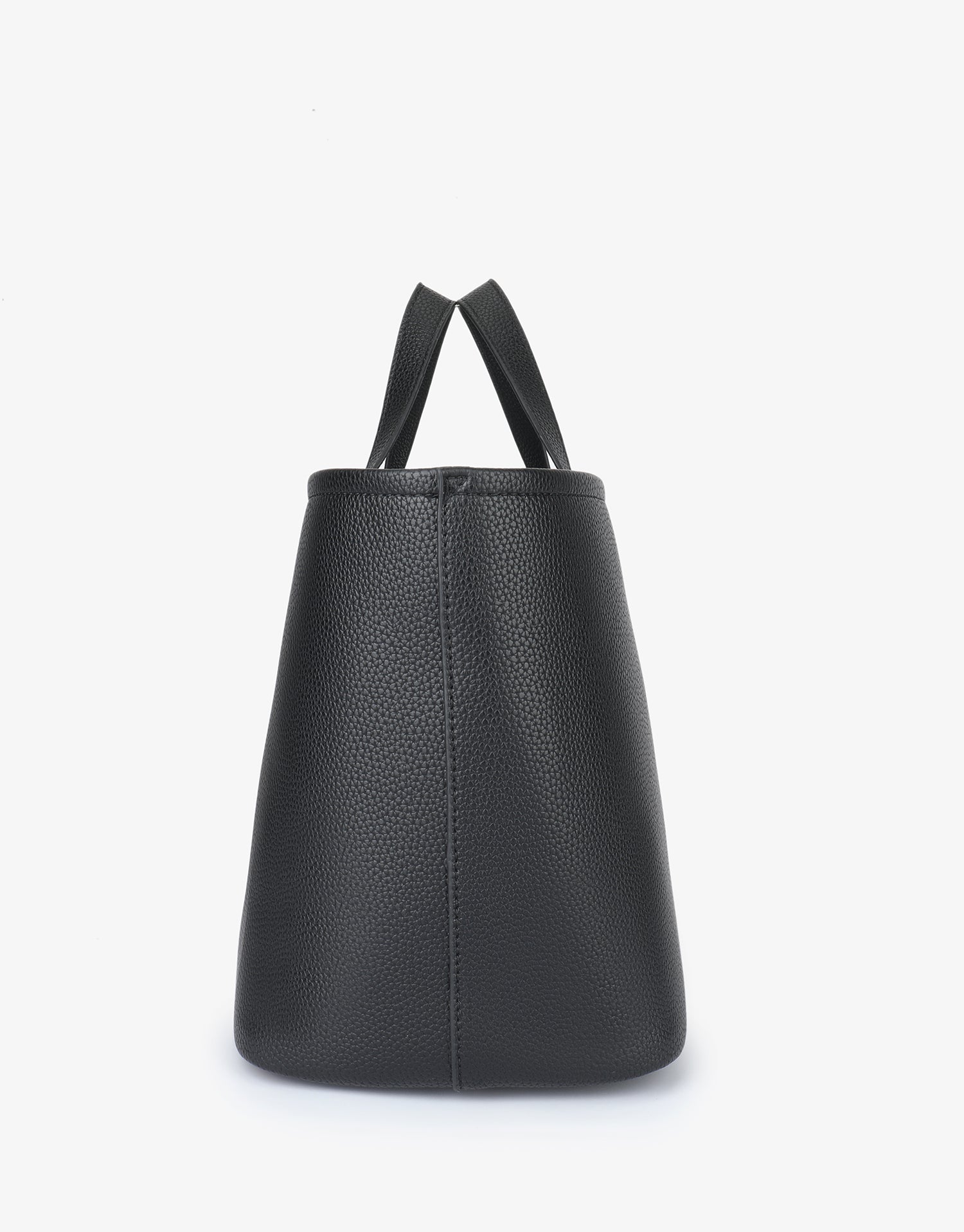 Side angle of a black pebbled vegan leather Nala Tote by Remi and Reid highlighting the clean vertical seams.