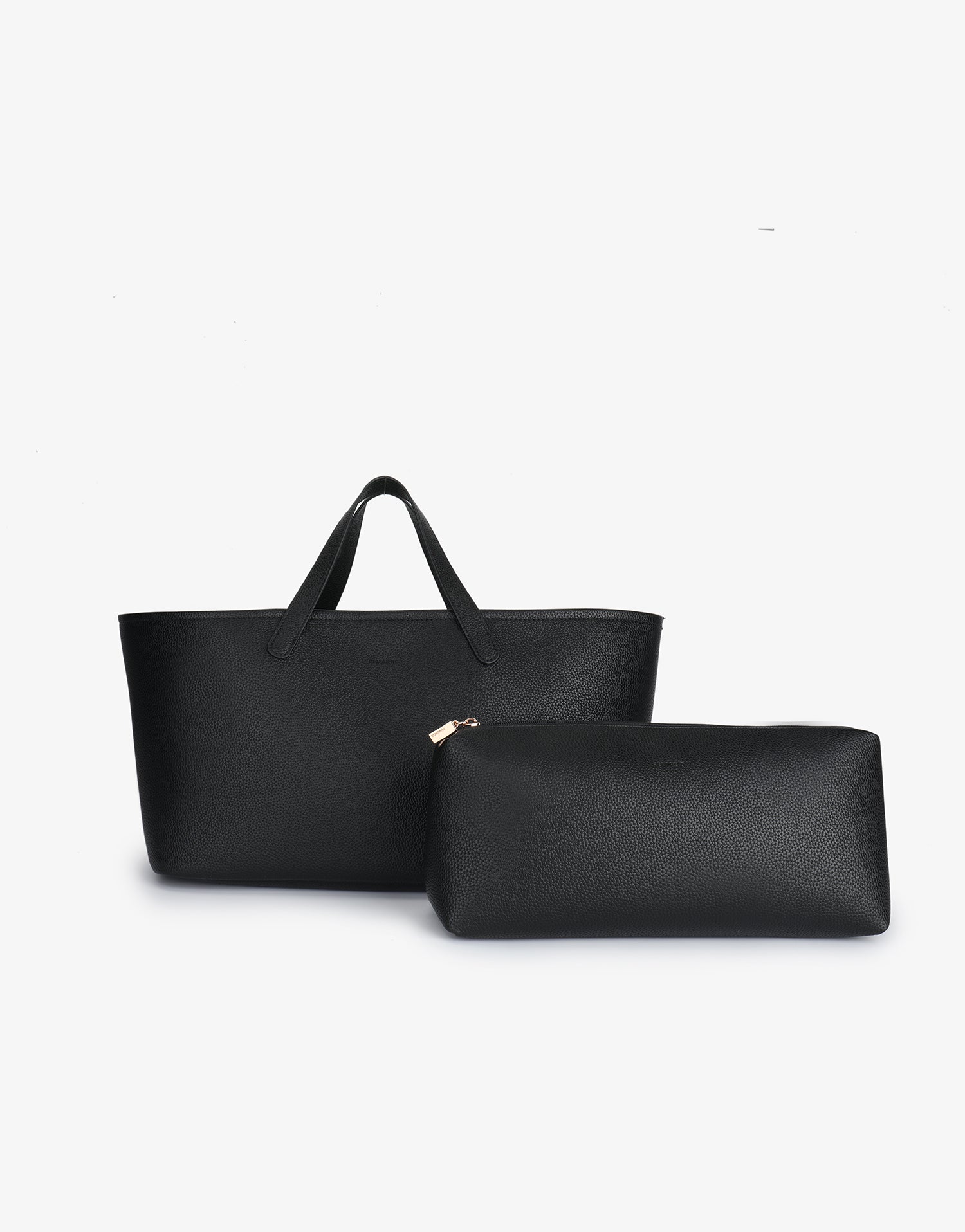 Black Nala Tote by Remi and Reid shown next to a coordinating rectangular accessory clutch in a pebbled vegan leather finish.