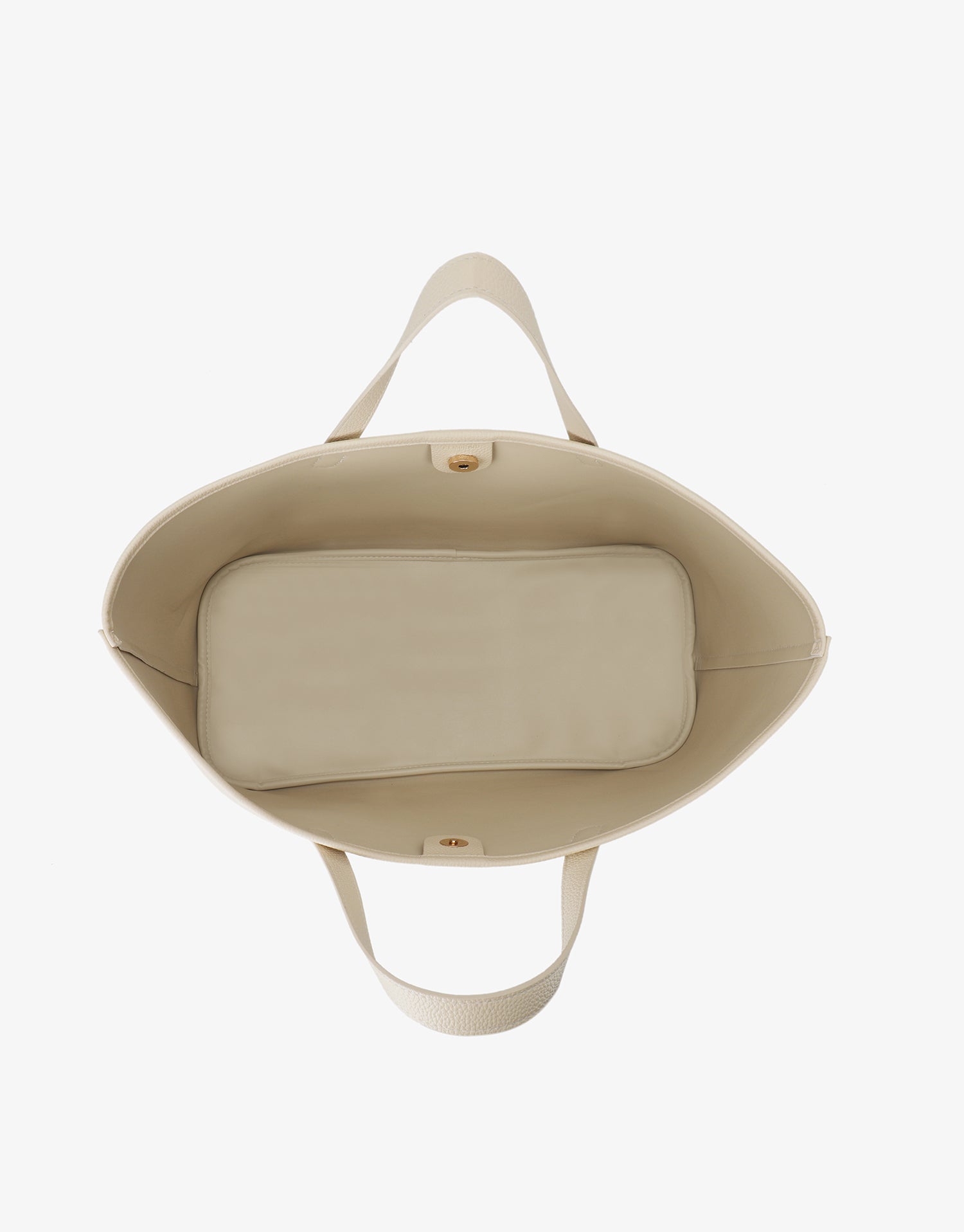 Top-down interior view of the ivory Remi and Reid East West Nala Tote showing a spacious compartment and magnetic snap.