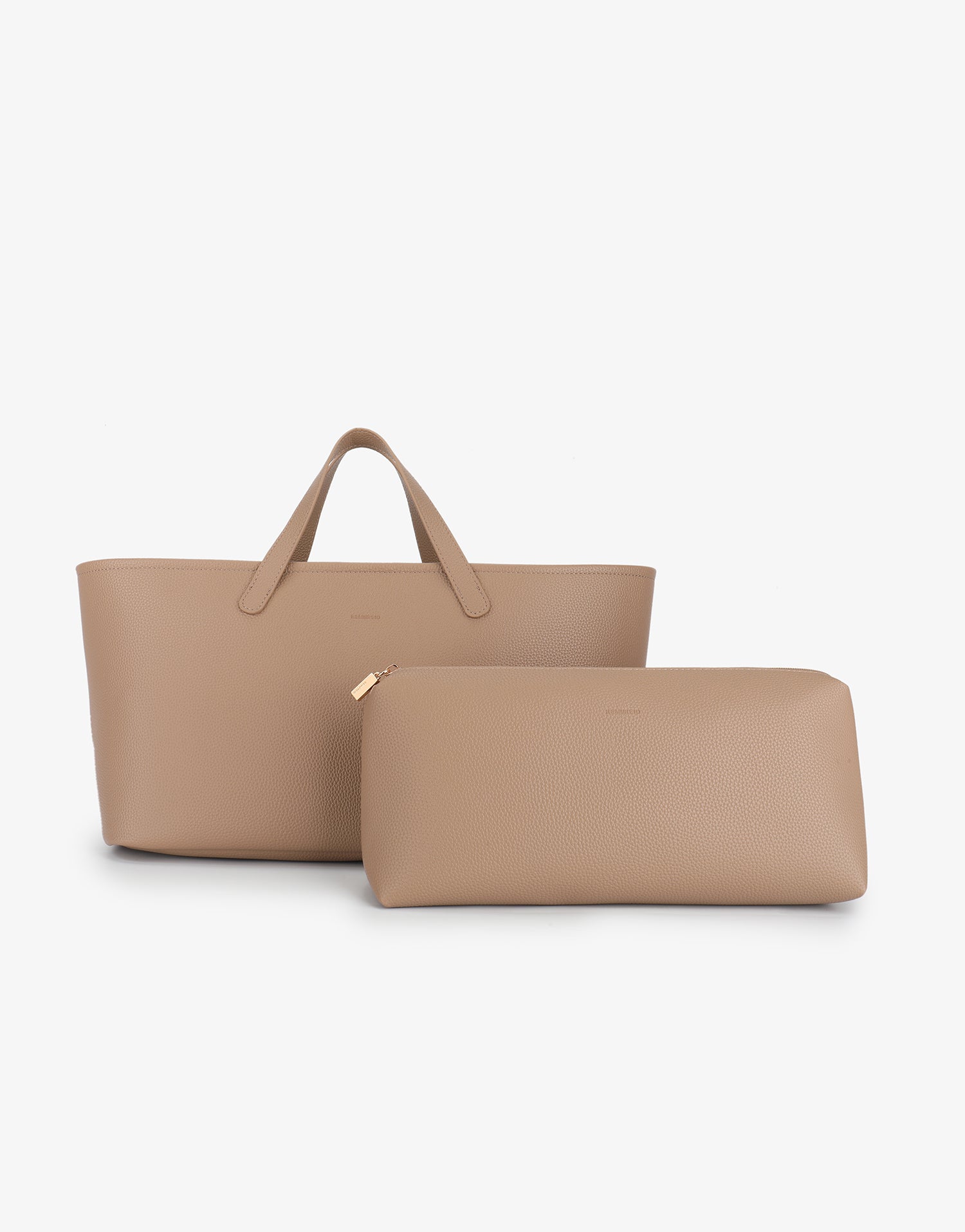 Elongated shoulder hand bag by Remi and Reid with matching elongated rectangular zippered pouch in taupe color.