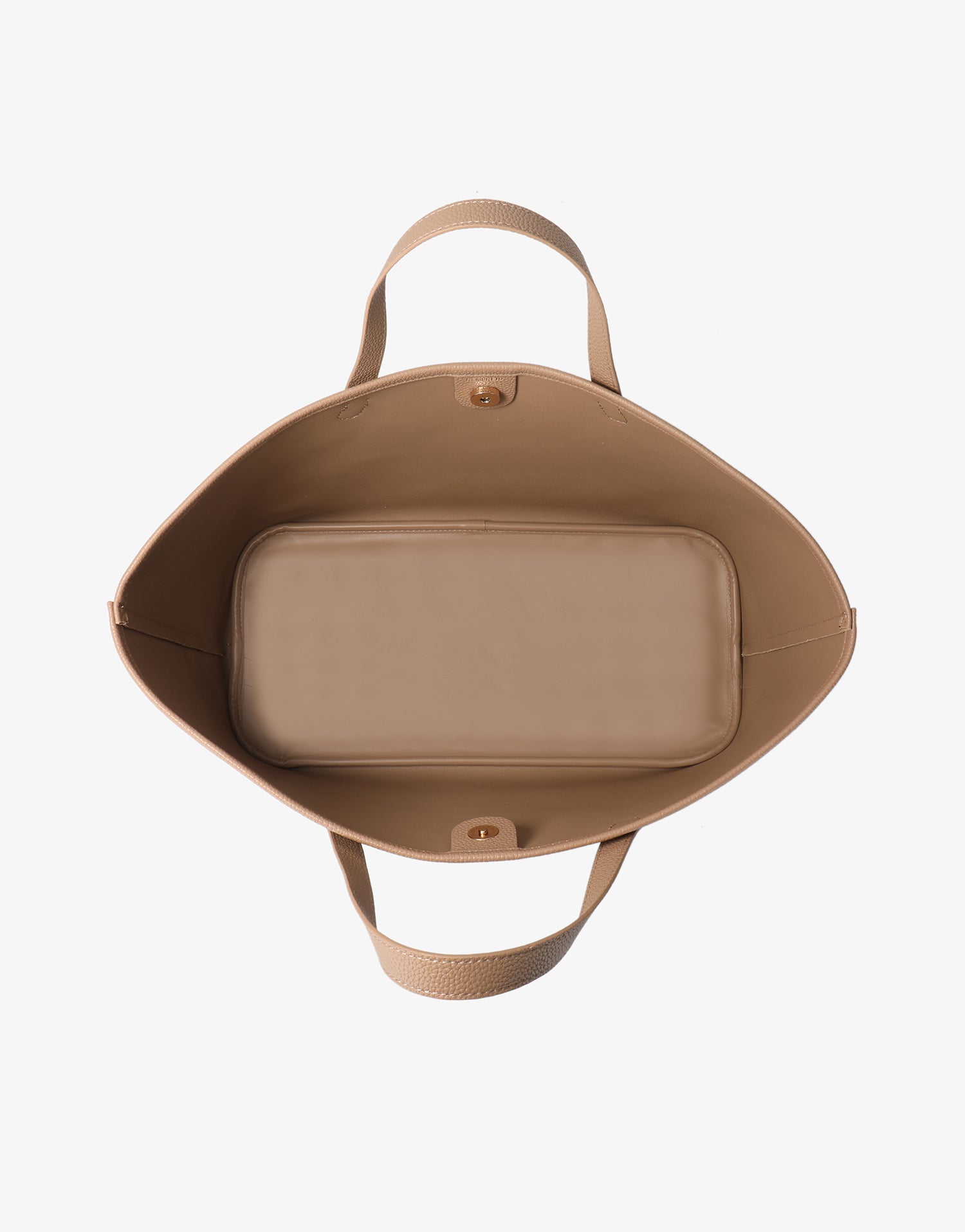 Top-down interior view of the Remi and Reid East West Nala Tote showing a spacious taupe compartment and magnetic snap closure.