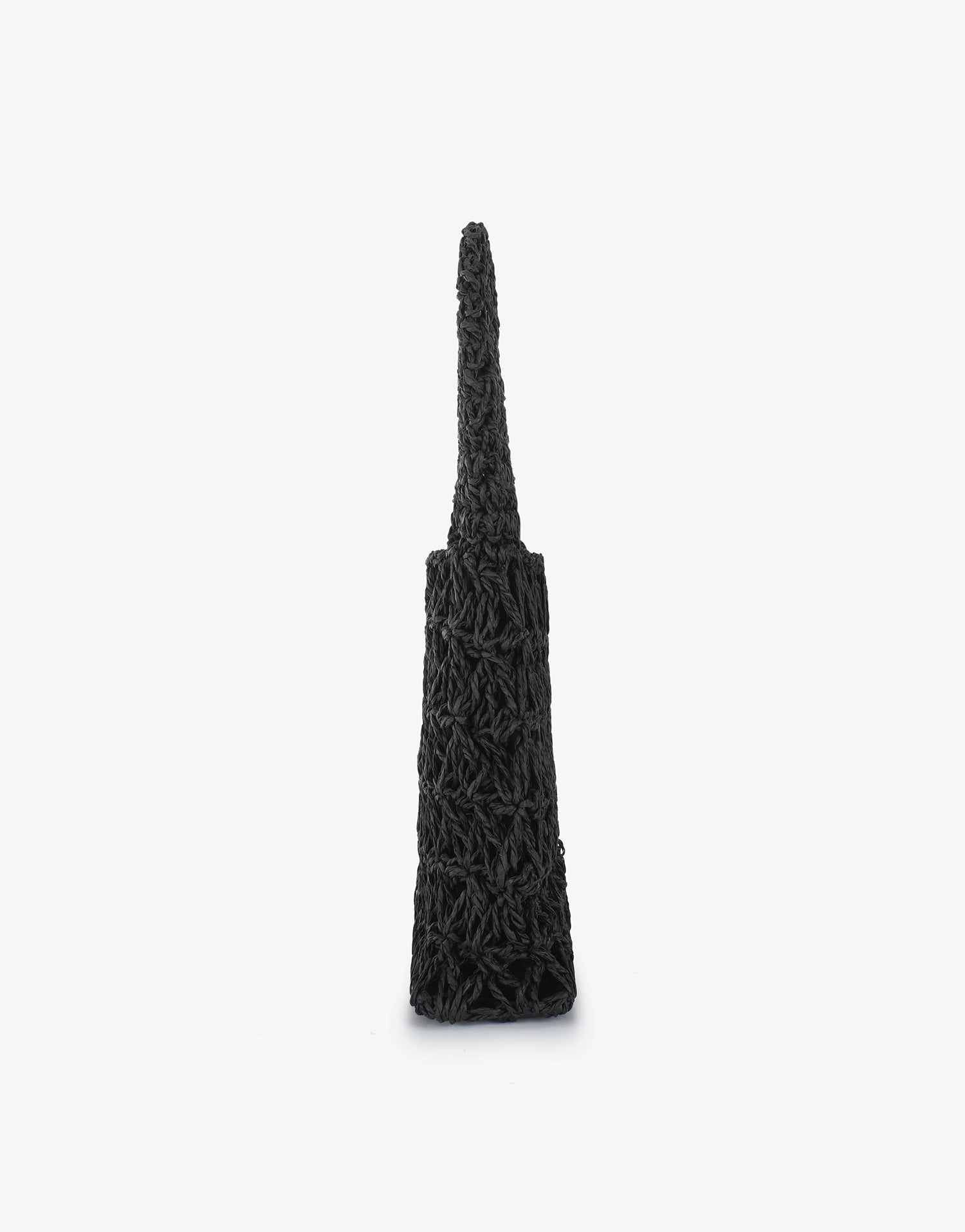 Side profile of Nigella woven in black showing the open weave crochet structure by Remi and Reid.