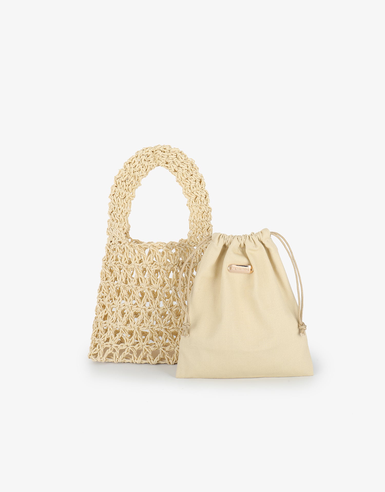 Woven Nigella beige handbag and inner drawstring pouch by Remi and Reid.